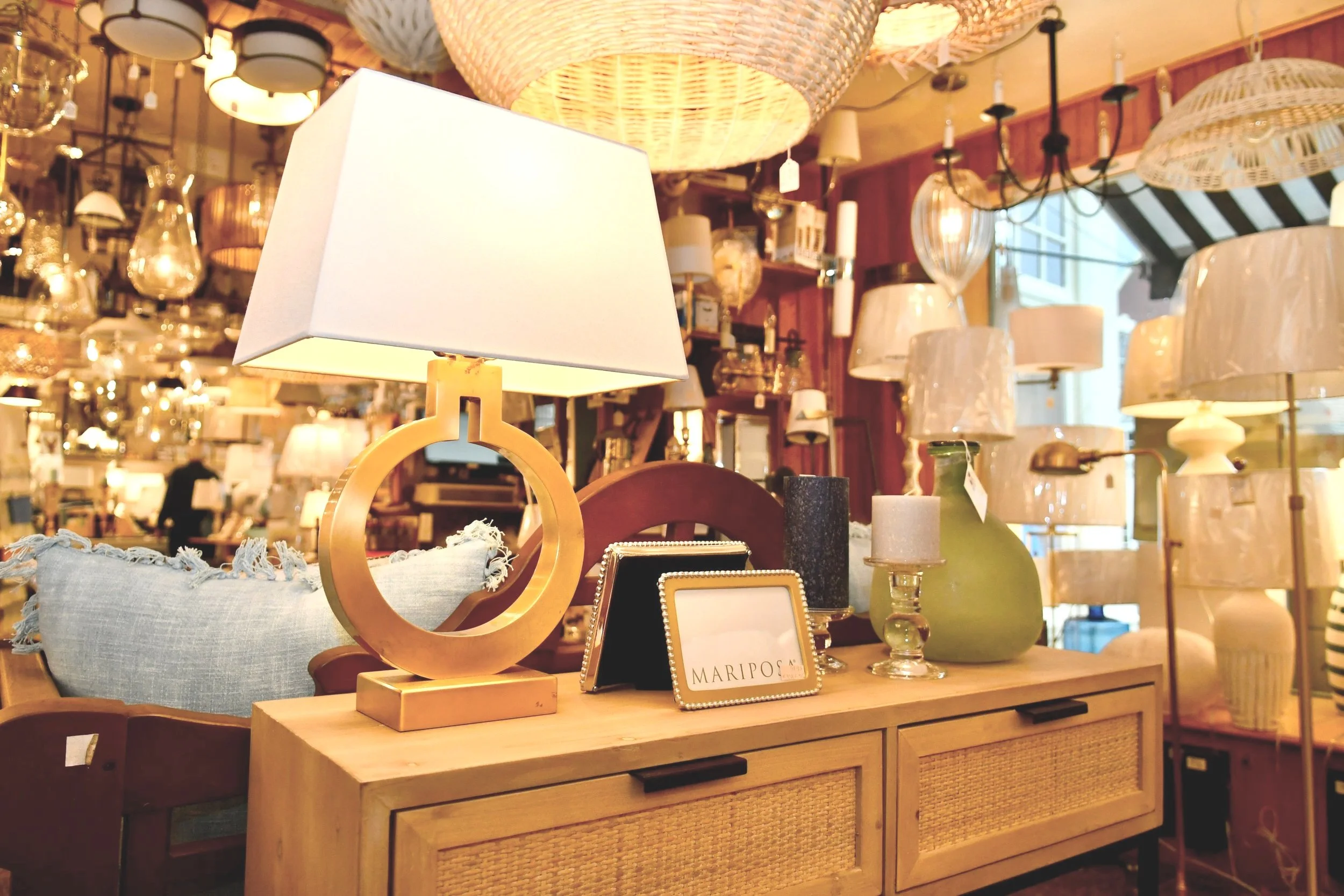 Lighting fixtures featuring glass, metal, and refined finishes